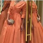 Женское вечернее платье с V-образным вырезом и бантом