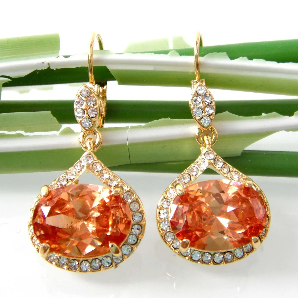 Серьги кольца Navachi с золотым кубическим цирконием и кристаллом в виде капель воды