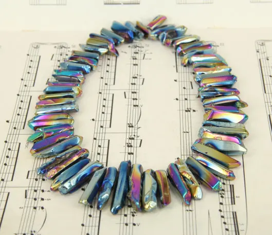 

58pcs/strand Polished Raw Crystals Points,Rainbow Titanium Quartz Crystal Top Drilled Stick Beads Pendants Bulk 6-10x15-46mm
