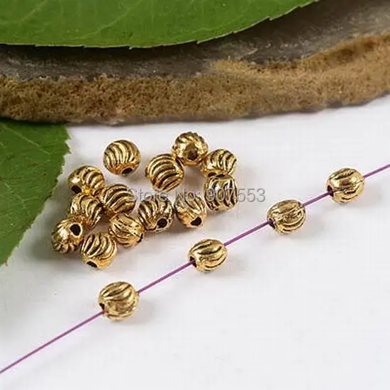 

160pcs dark gold tone curved wire oblate beads h1959