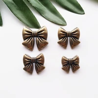 10pcs bow knot antique brass metal button sewing on one hole buttons for clothes bag fashion craft diy decoration 15182023mm