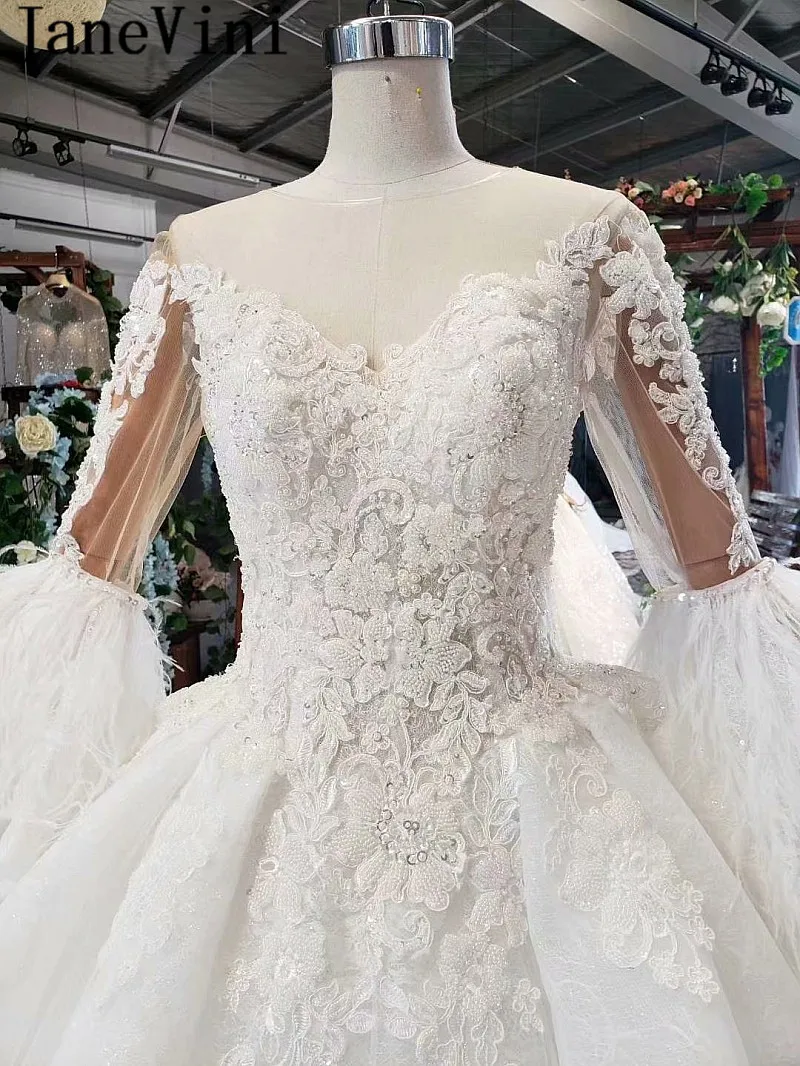 JaneVini Dubai Beaded Wedding Dress Feathers Long Sleeves Lace Pearls Ball Gown Bridal Dresses Luxury African Wedding Gowns 2020