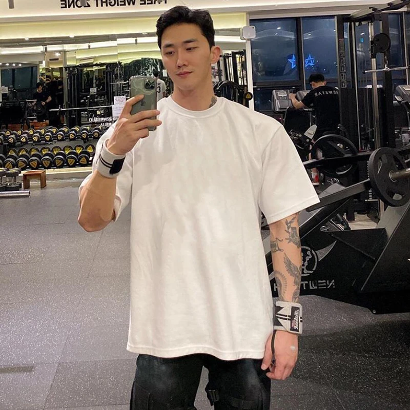 

Oversized T shirt Men Solid Cotton Gym Clothing Bodybuilding Fitness Loose Sportswear T-shirt Streetwear Hip-Hop Tshirt