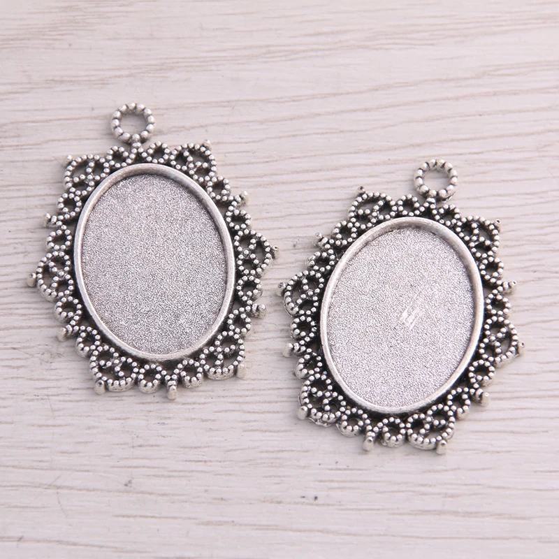 

Sweet Bell 10pcs 18*25mm Inner Size Two Color Metal Alloy Simple Openwork Lace Oval Cabochon Pendant Setting Jewelry Findings