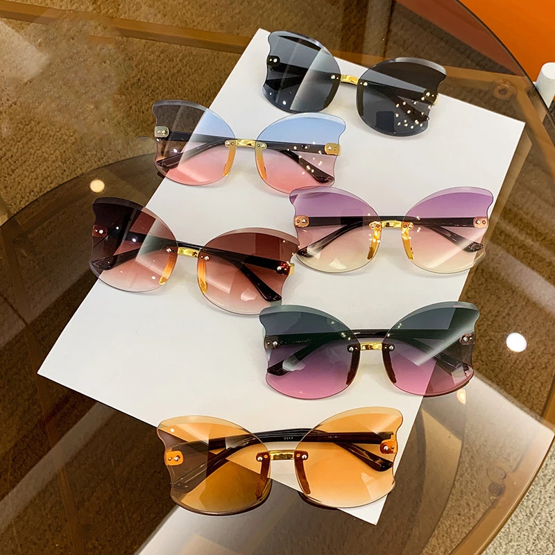 

2022 New Cat Eye Sunglasses Kids Children Brand Designer Rimless Round Sun Glasses for Girls Boys Eyewear UV400 Oculos De Sol