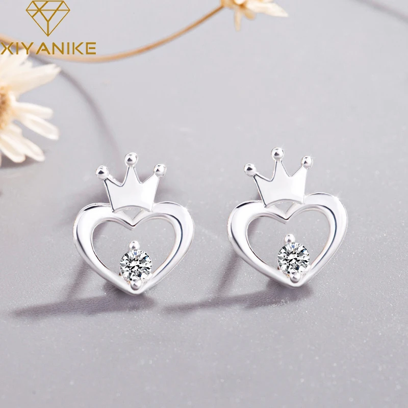 

XIYANIKE Silver Color Fashion Creative Crown Hollow Heart-Shaped Stud Earrings For Women Prevent Allergy Jewelry Gift