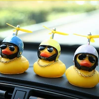 lucky duck in the car duck on the steering wheel in the helmet on a bicycle car ornament dashboard accessories