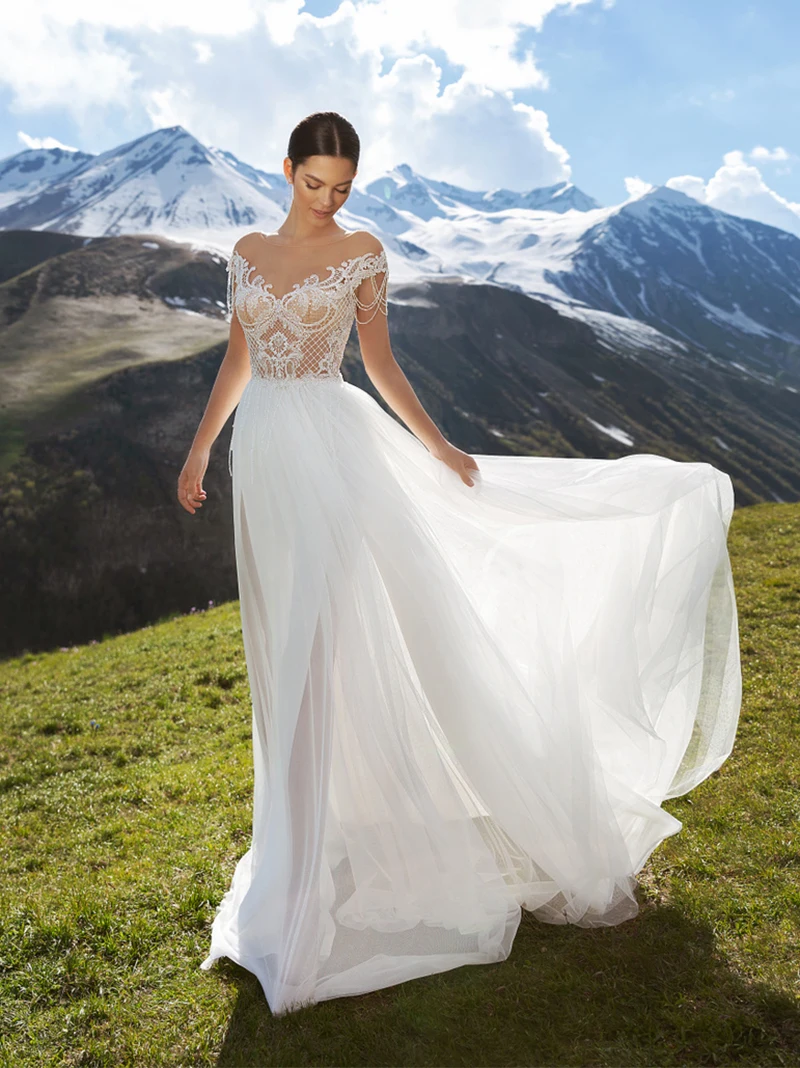 

2021 Бохо пляжное свадебное платье из фатина с высоким разрезом прозрачный кружевной Кепки рукава из бисера Ленточки 2021 трапециевидной формы...