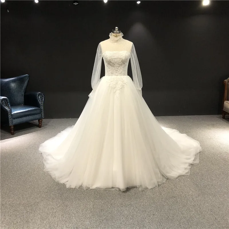 

2021 Newest High Quality Real Sample Ivory Lace Beading High Neck Long Sleeves Ball Gown Floor Length with Train Wedding Dress