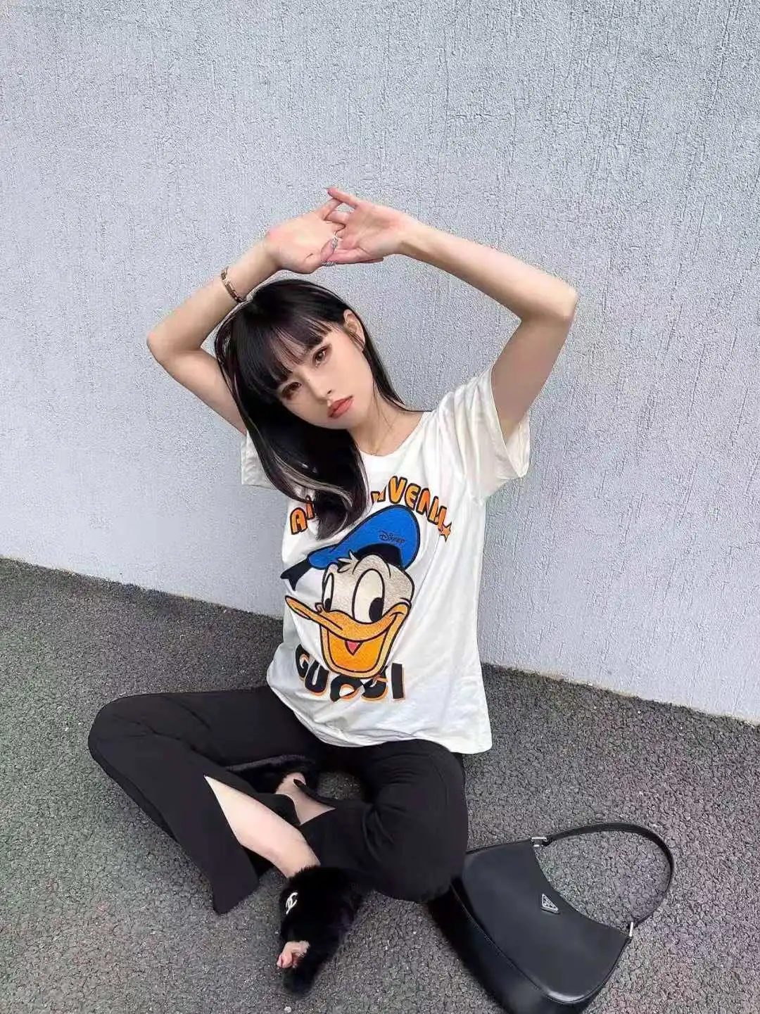 

2021s new popular logo Donald Duck cartoon couple outfit trend loose T-shirt men and women with the same bloggers with the same