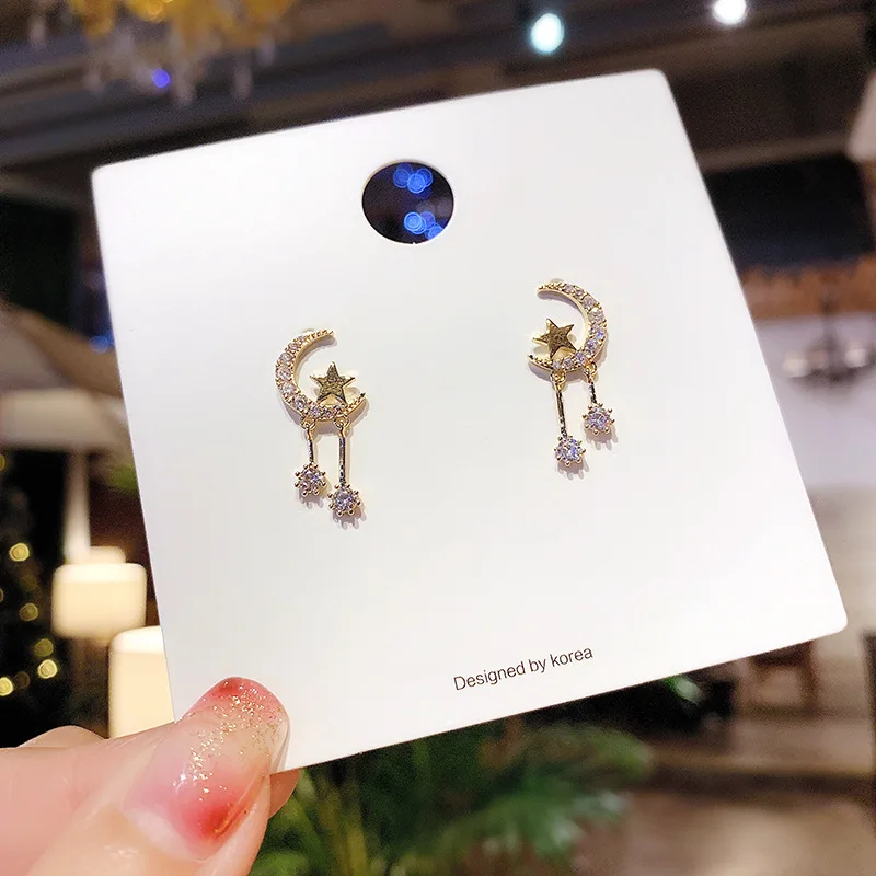 

Asymmetric star moon Diamond Earrings female 925 silver needle temperament Korean personality net red flow Su ear nail Earrings