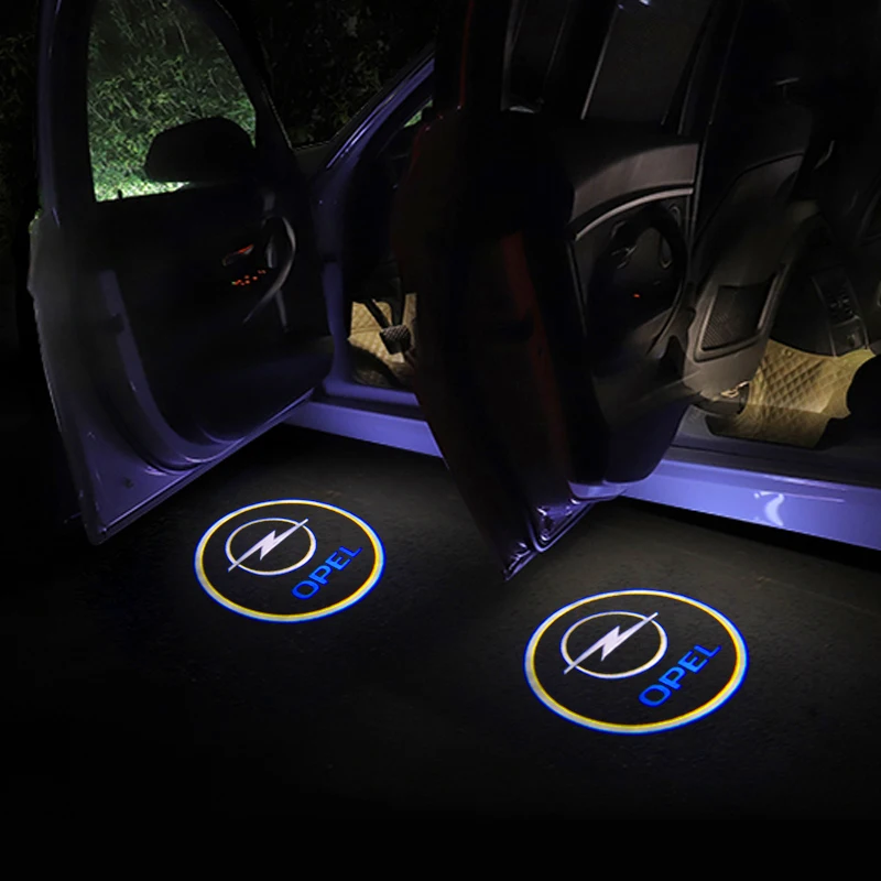 проектор с маркой автомобиля. проектор логотипа в дверь. подсветка дверей x1 f48. лазерная проекция логотипа в двери тойота камри. проектор логотипа в дверь.