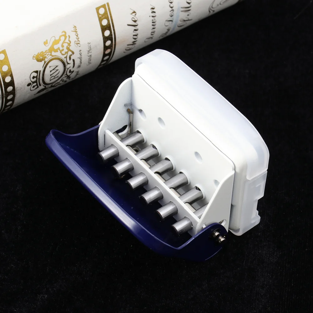 

1Pc 26 Holes Puncher A4 Paper Notebook Stationery Puncher DIY Handheld Puncher Tool for Students (White)