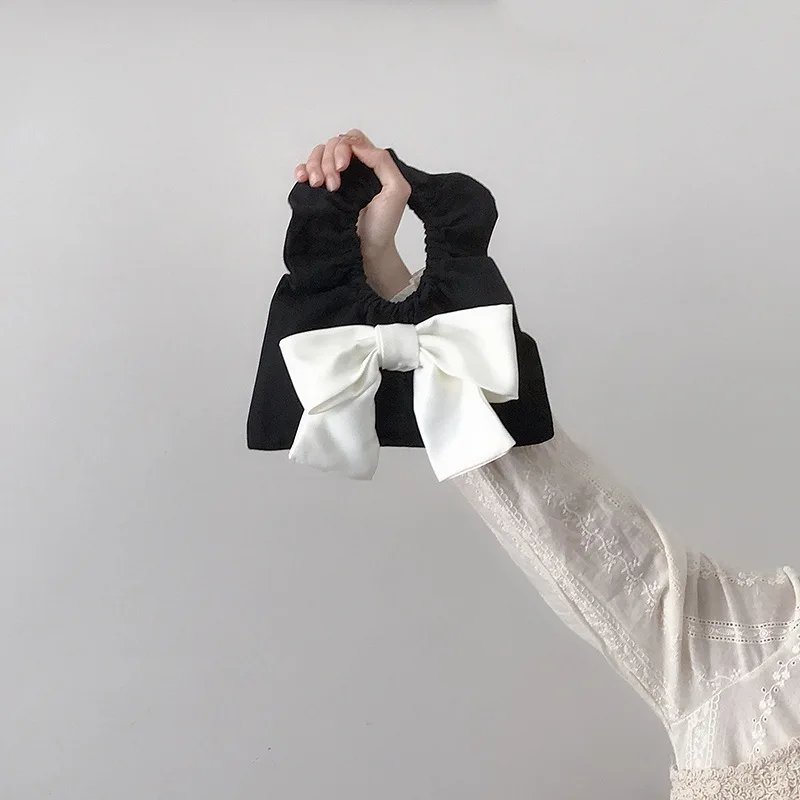 

2021 New INS Web Celebrity Bow Wrist Wrap Ruffled Lace Mini Canvas Dumpling Wrap Clutch Handbags For Women