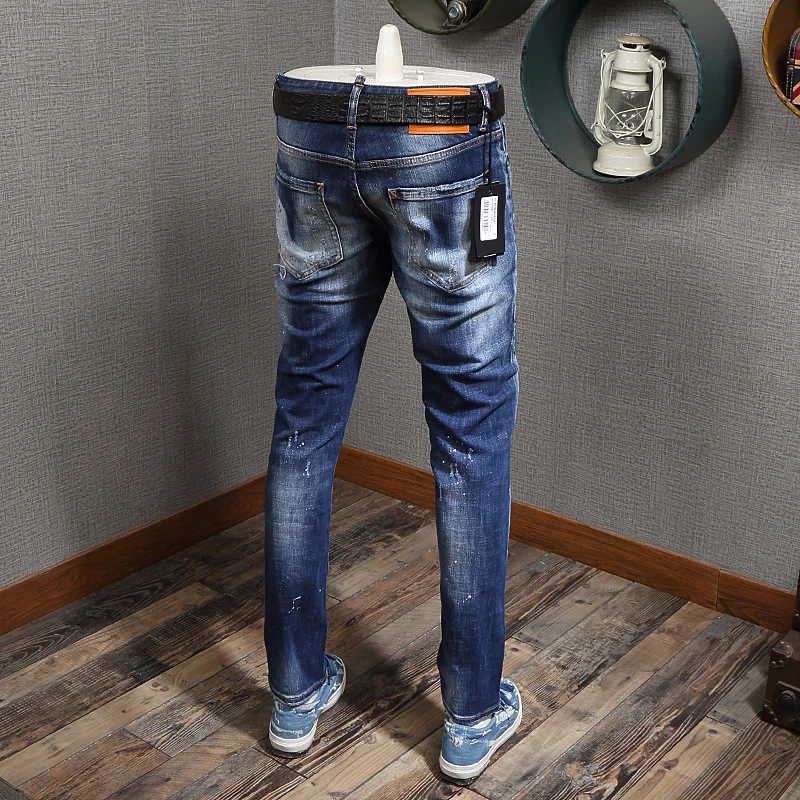 

Newly Designer Fashion Men Jeans Blue Color Slim Fit Painted Ripped Jeans Men High Quality Streetwear Hip Hop Jeans Homme