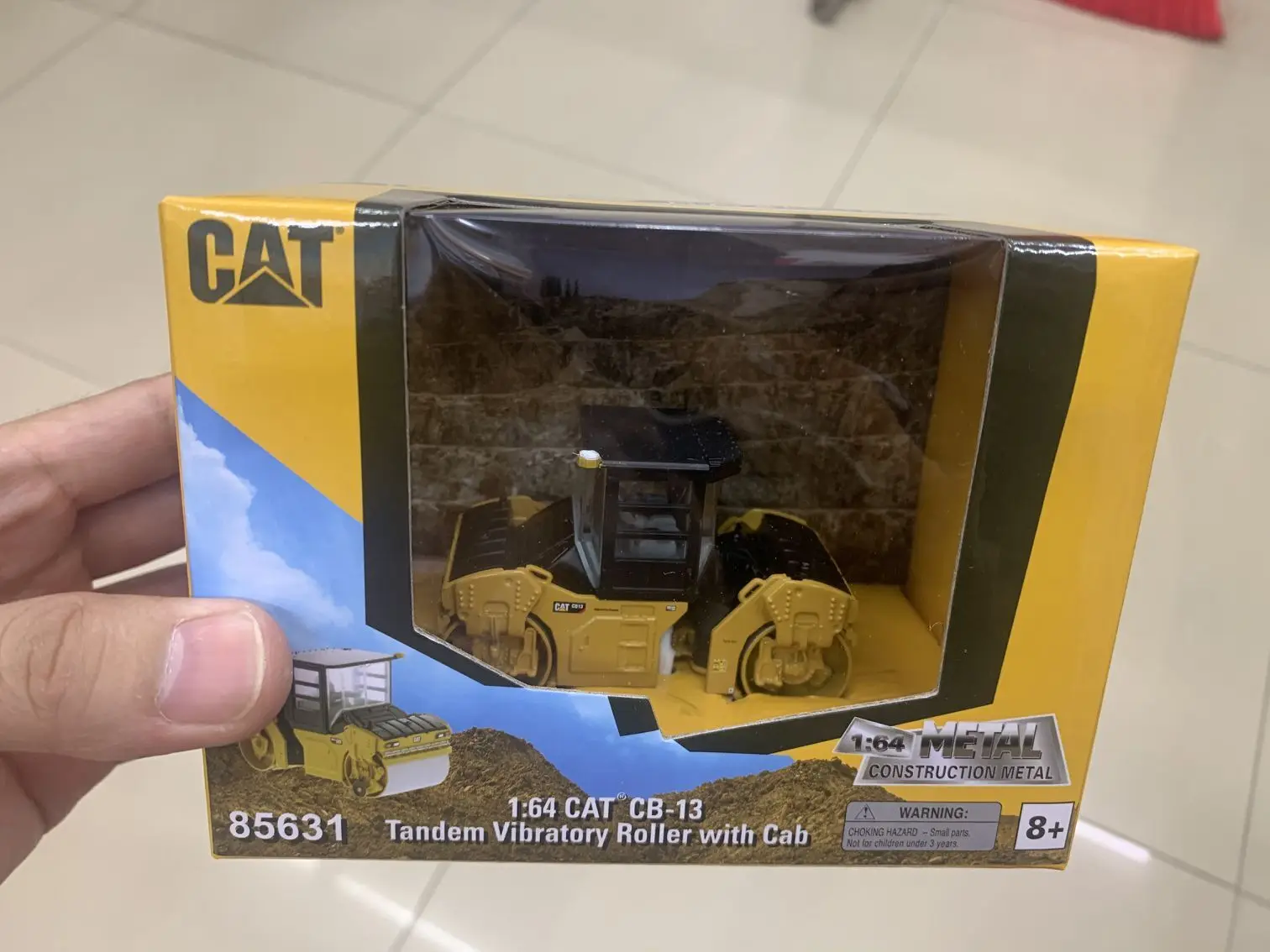 

Caterpillar Cat CB13 Tandem Vibratory Roller With Cab 1:64 Scale DieCast Model DM85631 New in Box