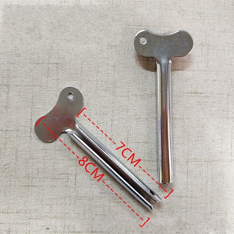 

Metal toothpaste squeezer toothbrush holder wall-mounted toothpaste squeezer rolling tube squeeze bathroom small accessory sets