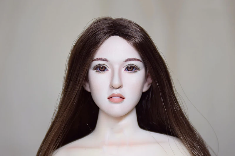 

1/6 scale female head sculpture with movable eyes 12-inch light-colored movable doll body in stock