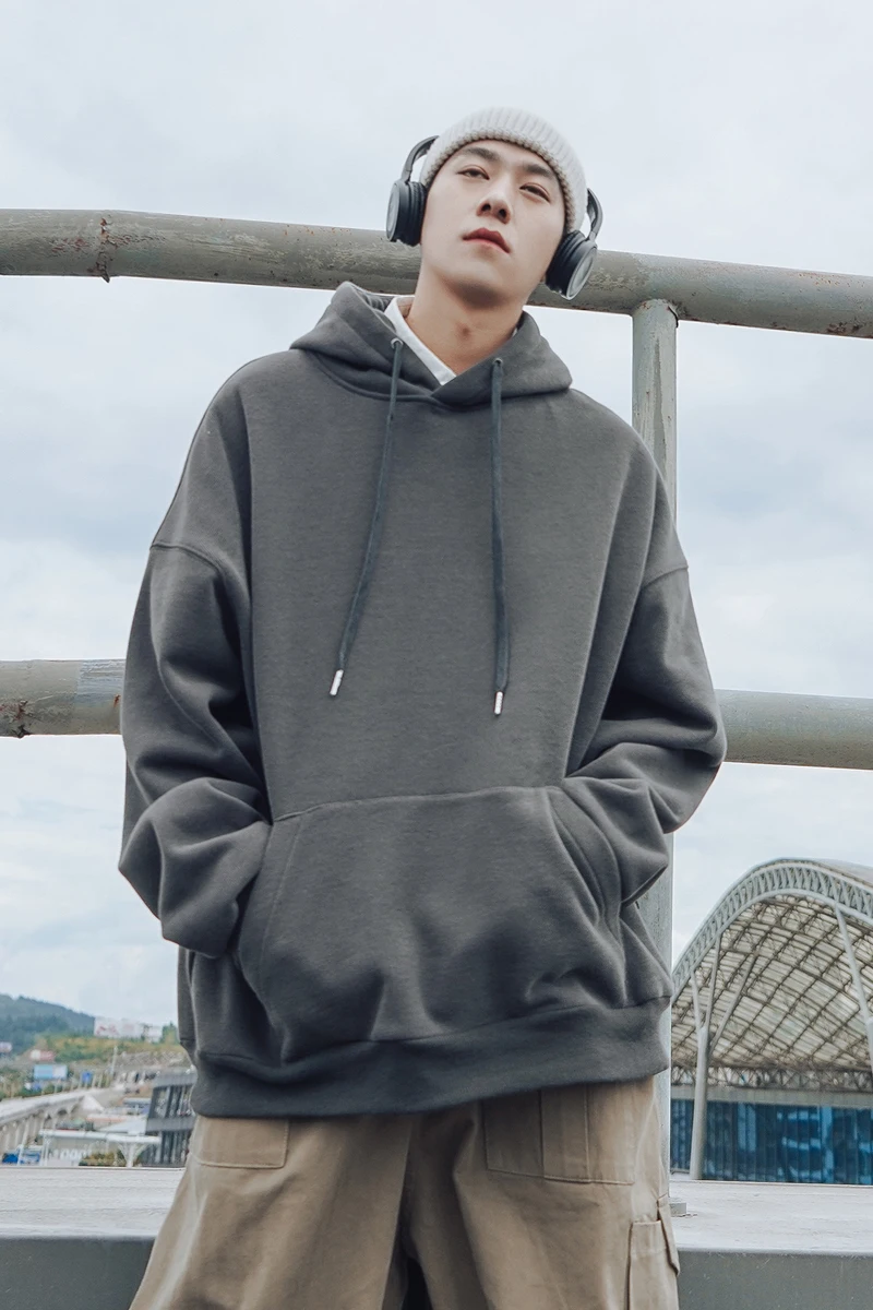 

Autumn and winter new solid color thick plus velvet sweater men hooded pullover loose clothes trend youth coat