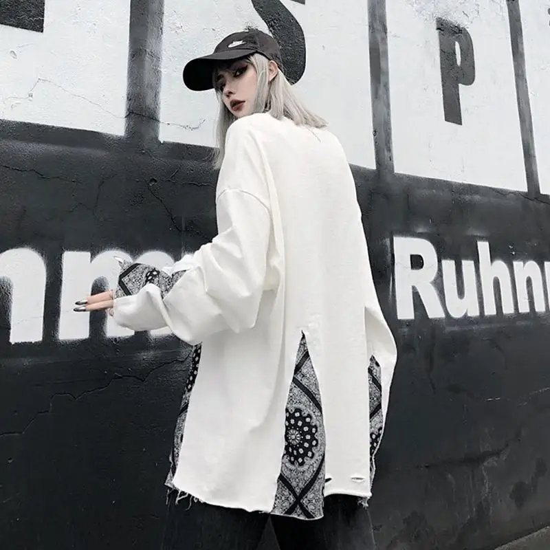 

Fake two pieces of sweater women early autumn new Korean version of INS retro cashew flower loose net red hole coat tide