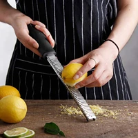 citrus lemon zester cheese grater parmesan cheese lemon ginger garlic nutmeg chocolate vegetables fruits kitchen tools