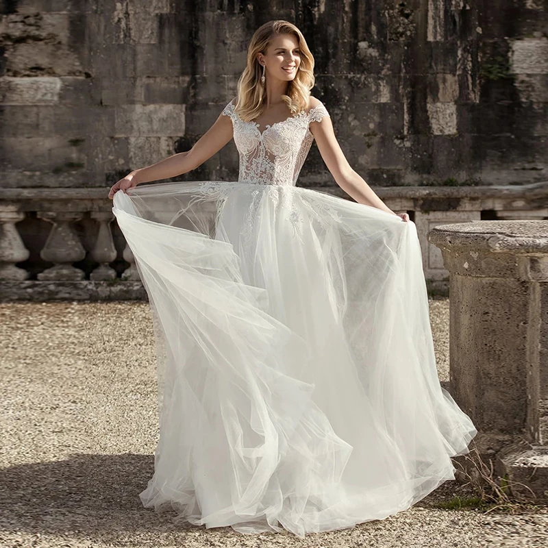 

Latest Modern Ivory Lace Cap Sleeves Bridal Wedding Gowns Illusion Jewel Neck Sheer Back Appliqued Wedding Dress for Bride 2021