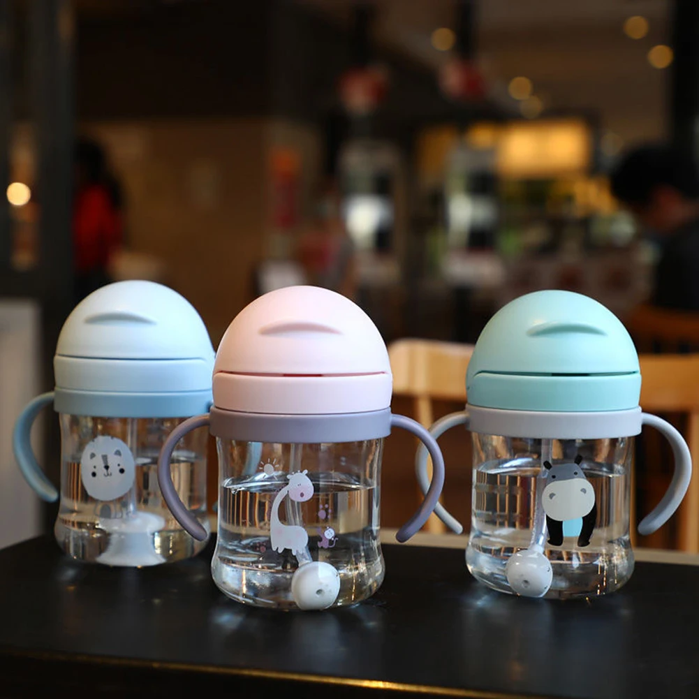 

Childrens Feeding Cup With Straw Anti Choked Handle Drinker Portable Newborn Training Water Cup Gravity Ball Baby Learn Drinking