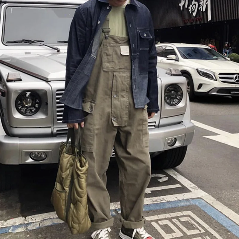 

Fashion Streetwear Men Fashion Design Suspender Jumpsuit Loose Straight Pocket Bib Men's Overalls Casual Trousers Jumpsuit