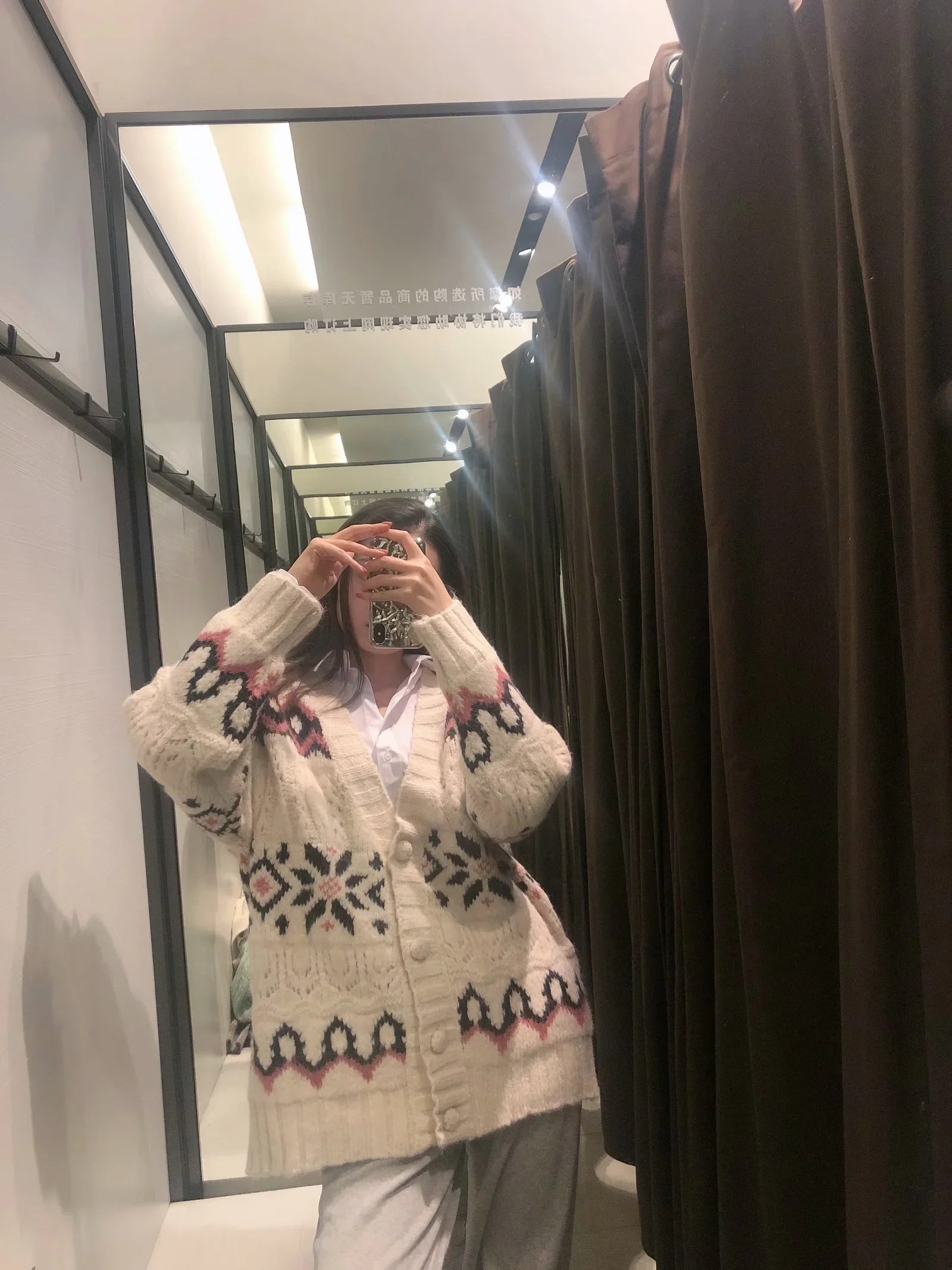 

A cardigan with a jacquard knit coat