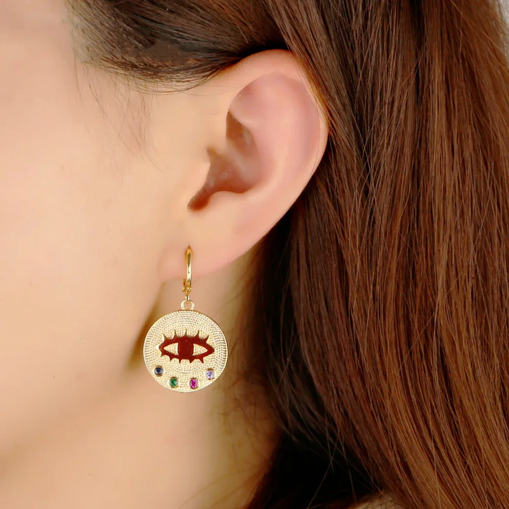 Уникальные золотые медали с глазами радужные фианиты серьги капли эффектные