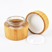custom engraving logo luxury cosmetic cream fancy glass jars and lids wholesale beauty skin care cream jar 30g 50g bamboo top