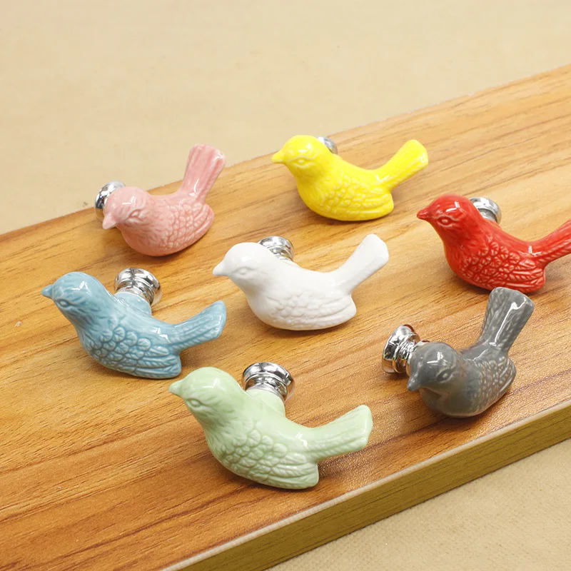 

Factory price ceramic handle modern pigeon cartoon children's cabinet drawer white single hole handle