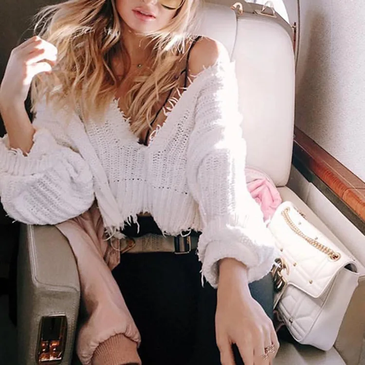 

Autumn / Winter 2020 Women's Solid Color Sexy Long Sleeve Knitted Deep V-Neck Open Navel Tassel Women's Loose Sweater