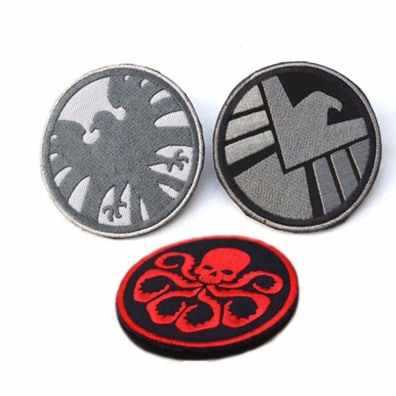 Значок девять змеиных родов Отдел отпуска и логотип агента подписанный двойной