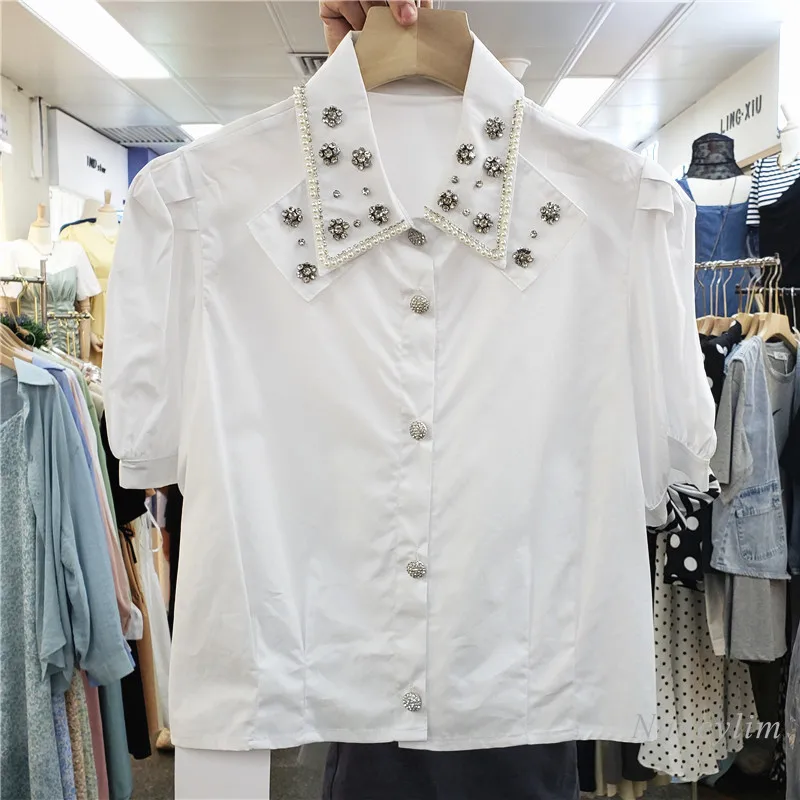 Chemise courte pour Femmes 2021 Été Nouveau Simple Boutonnage Manches Bouffantes Exquis Strass Revers Tout-Assorti Haut Court Dame Blusas