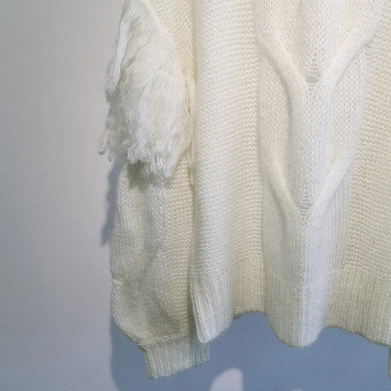 

2021 Autumn and Winter Round Neck Hollow White Sweater Casual Loose Puff Sleeve Stitching Tassel Long-sleeved Knitted Top Women