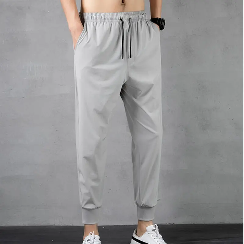 

High-quality summer thin style ice silk casual cropped trousers loose trend men's slim sports home trousers