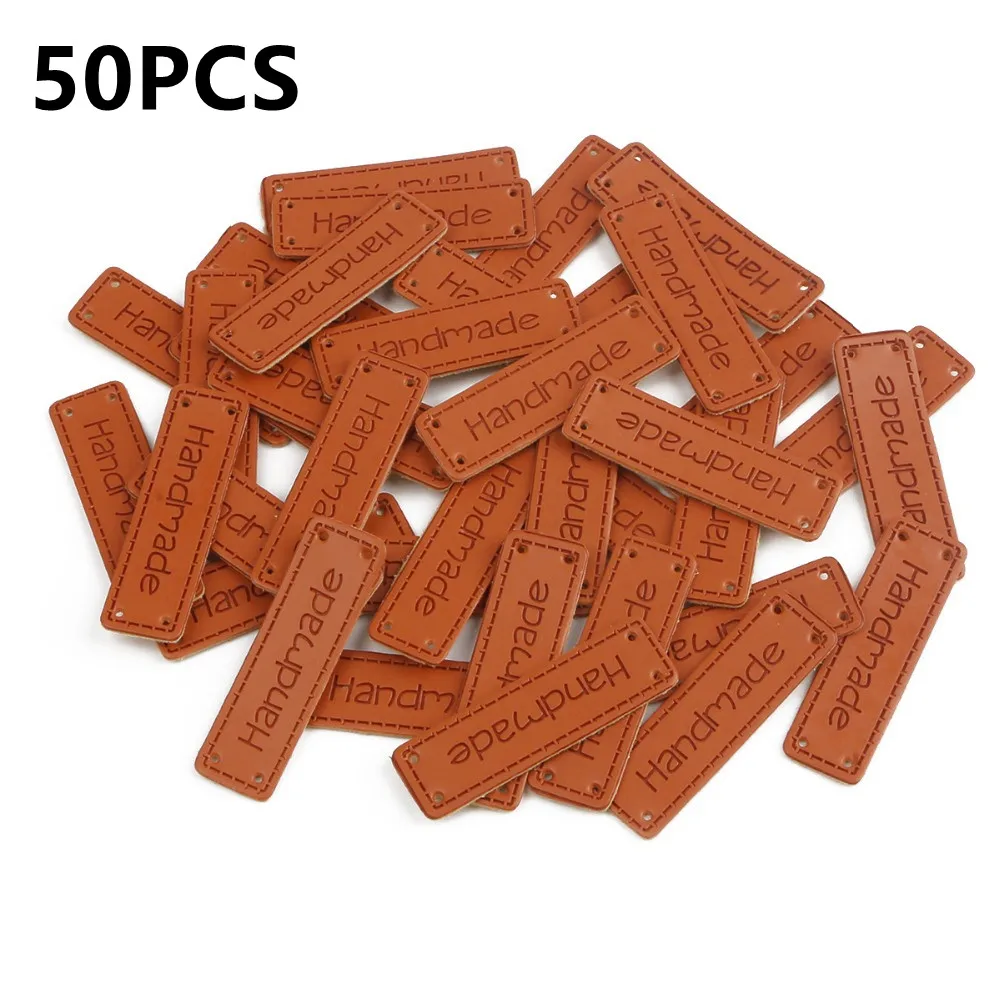 

50pcs Handmade Tags Embossed Brown PU Leather Tags with Holes for gift Clothes DIY Hats Bags Sewing Labels Garment Accessories