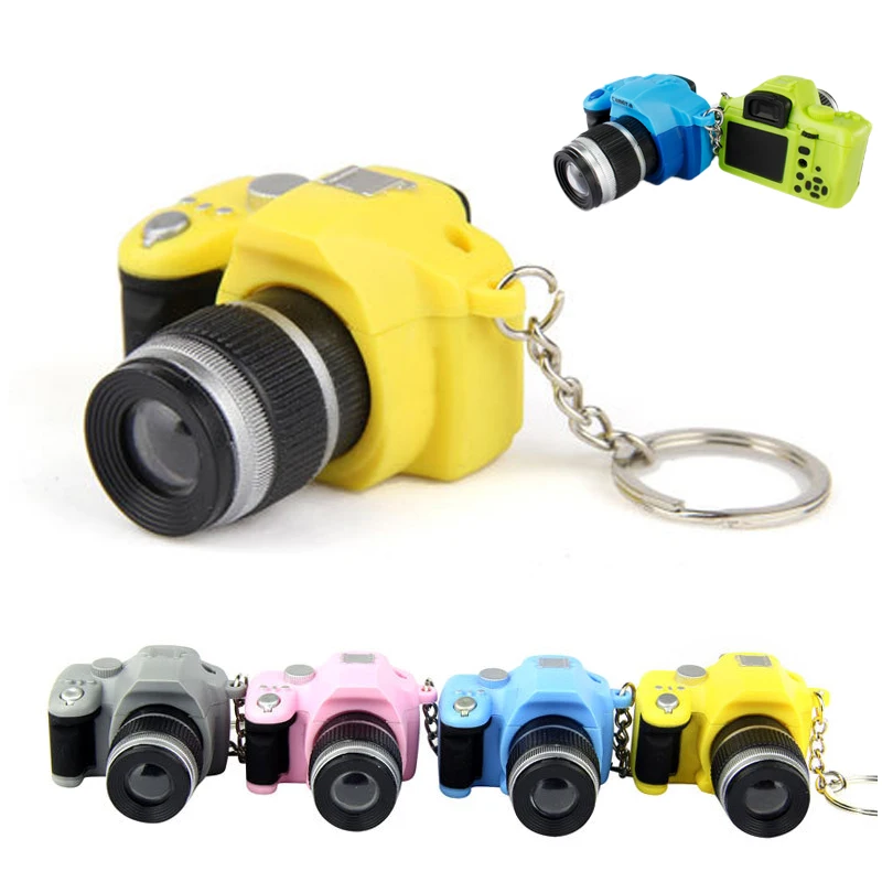 

1PCS male and female creative LED light emitting sounding daisy-phase SLR pendant student car interior accessories keychain S78