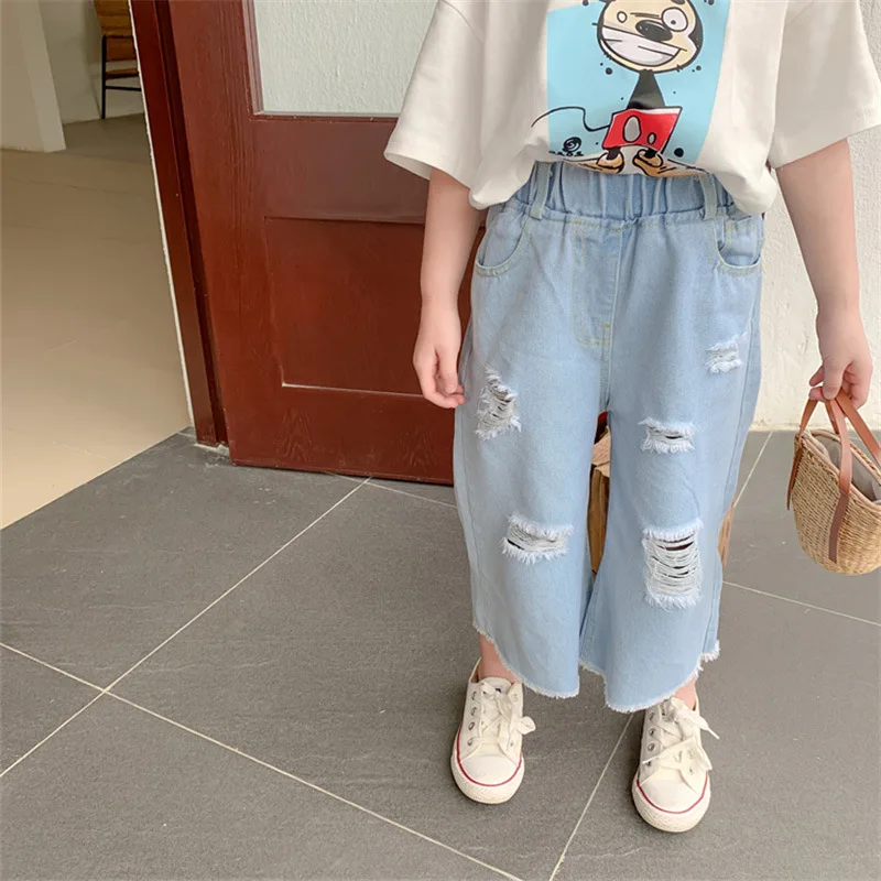 Рваные джинсы для девочек детские штаны с вырезами белые модные брюки широкими