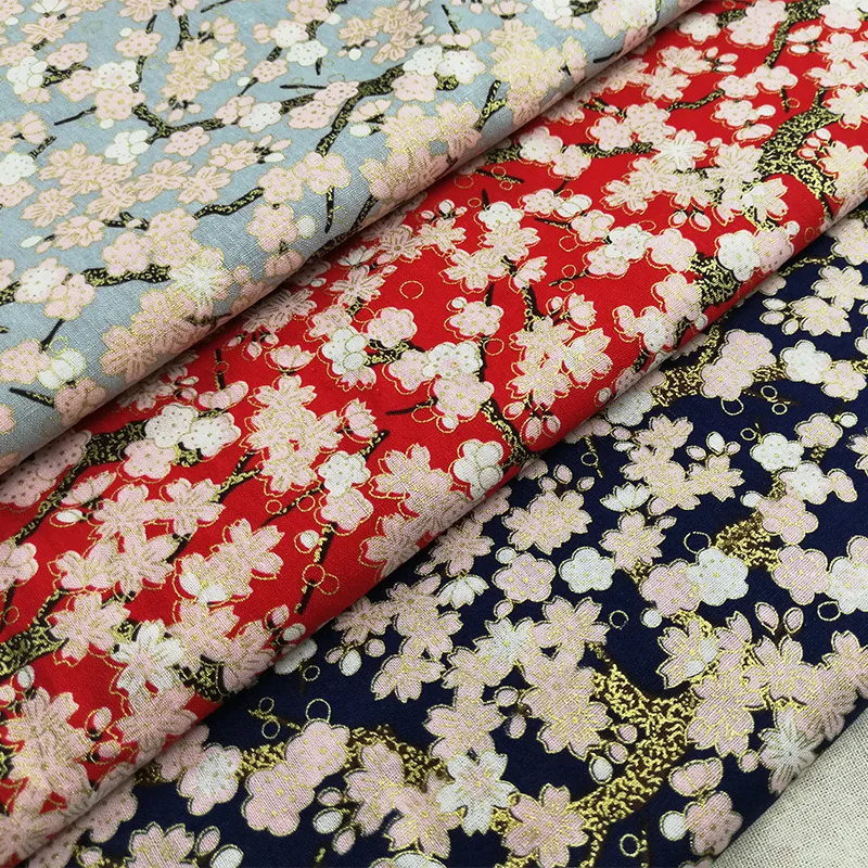

Cotton bronzing fabric Japanese style Japanese cherry blossom two-color spot supply clothing toys home decoration cloth