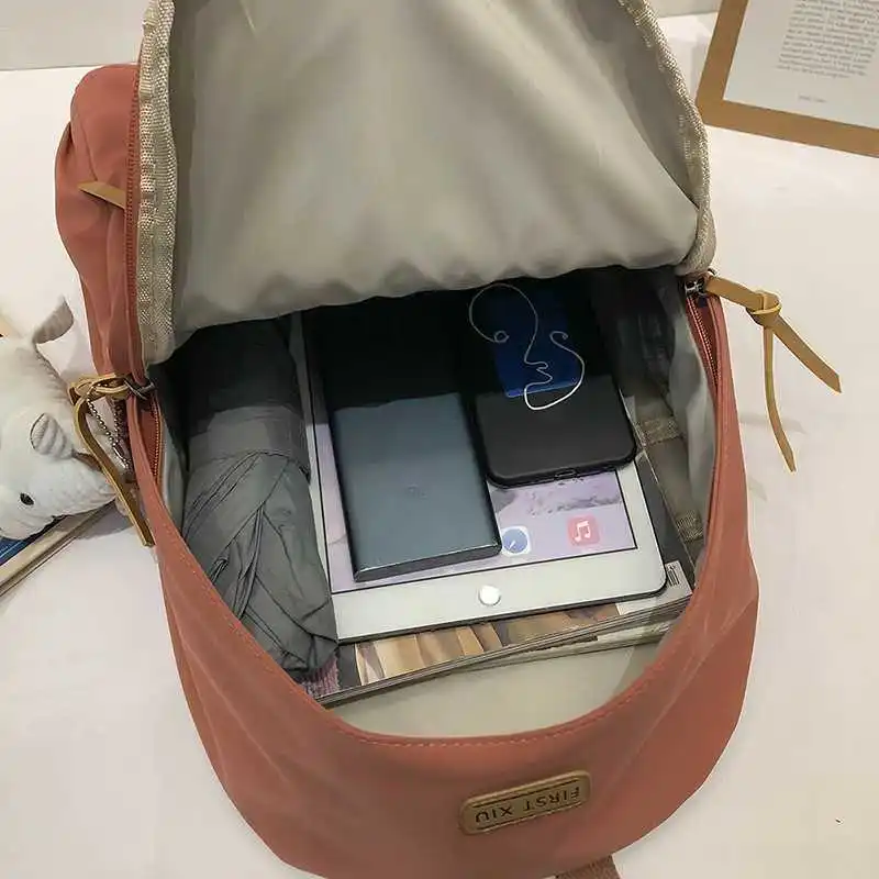 

2021 tendency of solid female backpack skill nylon-proof dlightweight water student bag light school bag travel bags