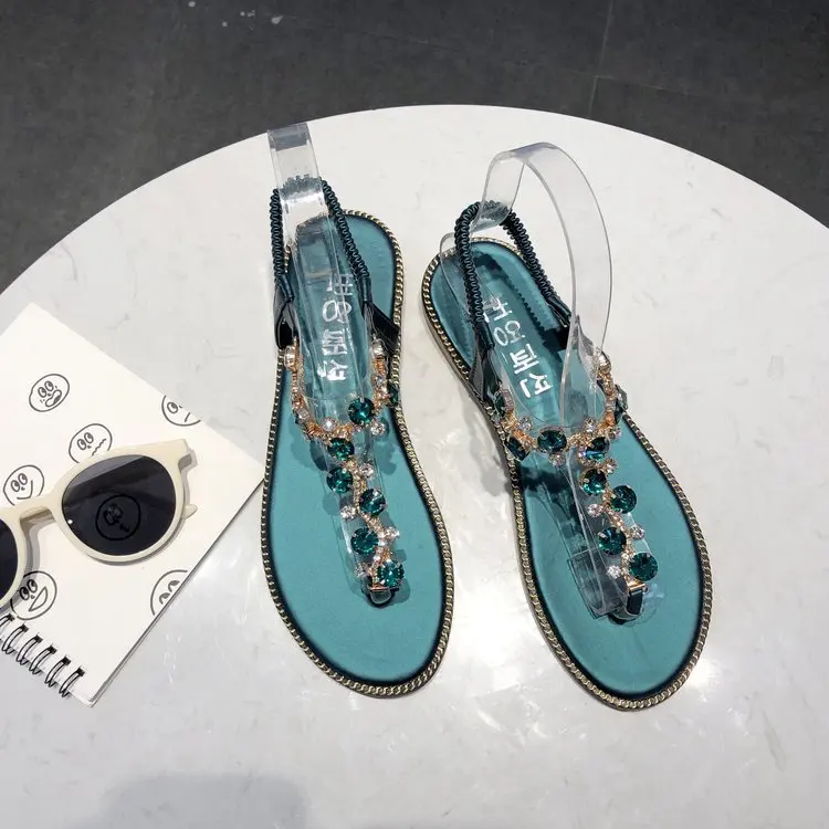

Clip toe sandals women's summer flat bottom 2021 new Korean ROMAN SANDALS flat heel Bohemian diamond beach shoes