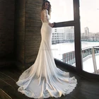 Платье свадебное атласное с юбкой-годе, длинными рукавами и аппликацией
