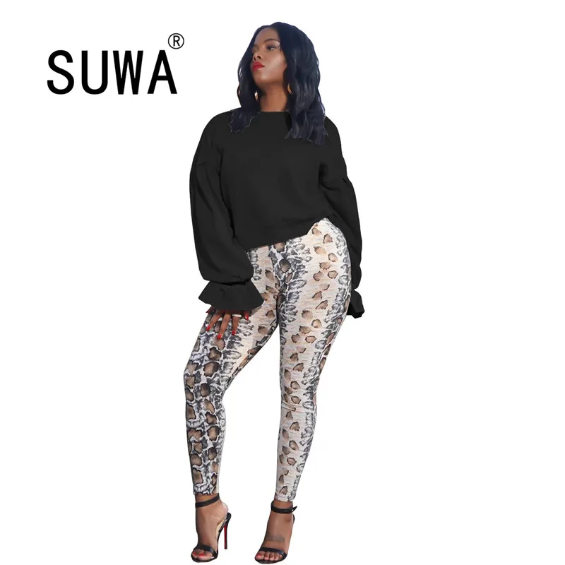 

Женская туника с круглым вырезом, длинным рукавом и поясом на спине