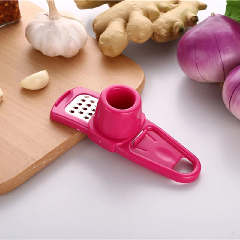 

1PC Creative Garlic Presser Ginger Cutter Candy Color Grinding Tool Multi-function Magic Garlic Presses Cooking Gadgets Tool