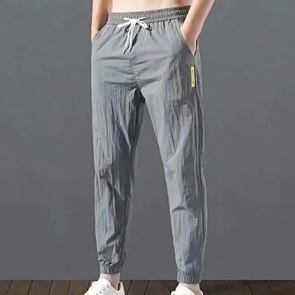 2021 Men  Pants Solid color Drawstring Summer Ankle Tied Pockets Trousers for Sports Gym Workout Jogging Sports Pants essentials 75% new arrival men harem pants printed multi pockets drawstring ankle tied cargo trousers for sports