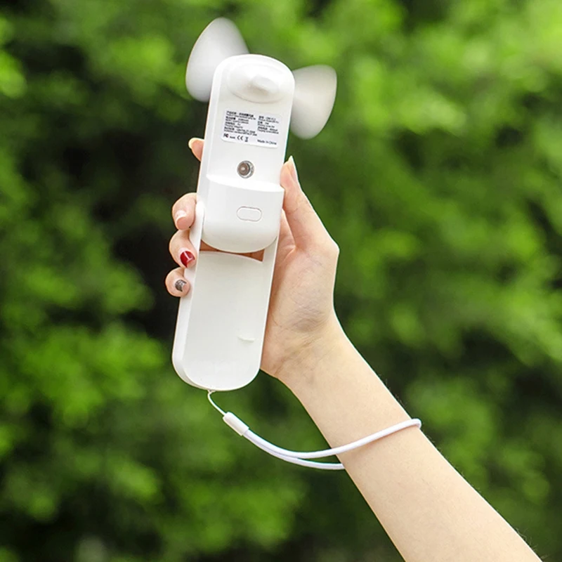 

Portable 2 in 1 Mini Fan Humidifier Rechargeable Handheld Fan Water Spray