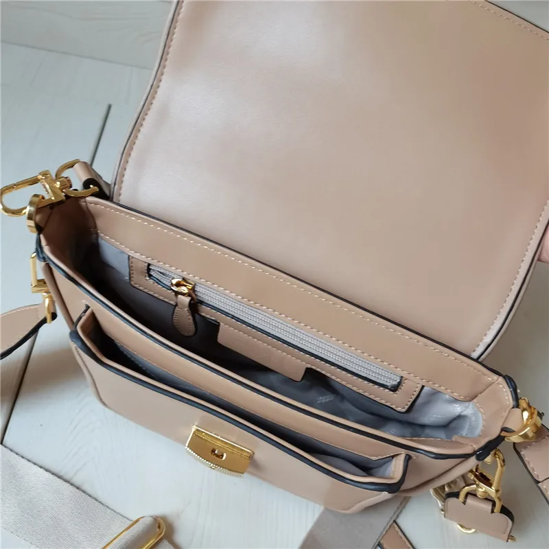 

New single shoulder slant across big brand design handbag postman stick bag lock flap armpit versatile small square bag