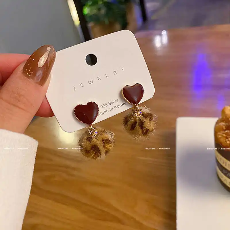 

New autumn and winter leopard hair ball earrings in 2020